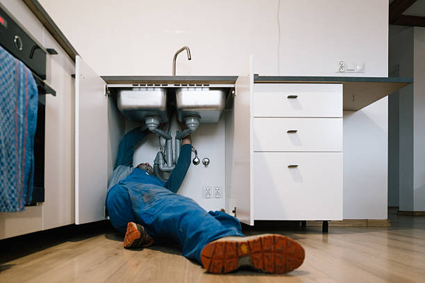Professional Drain Cleaning technician working in Raymond, NH